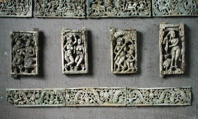 Four plaques depicting feminine figures and two decorative bands, from Begram by Afghan School